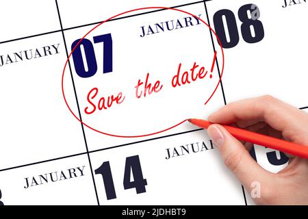 7th day of January. Hand drawing red line and writing the text Save the date on calendar date January 7.  Winter month, day of the year concept. Stock Photo
