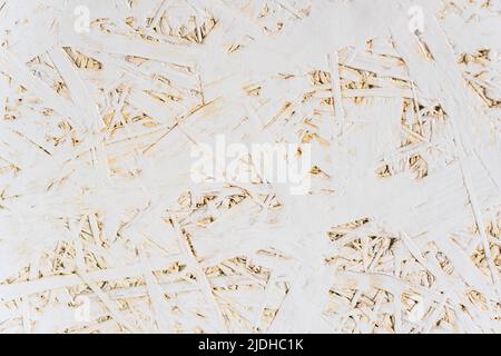 OSB board texture and pressed sandy brown shavings background. Oriented strand board surface texture Stock Photo