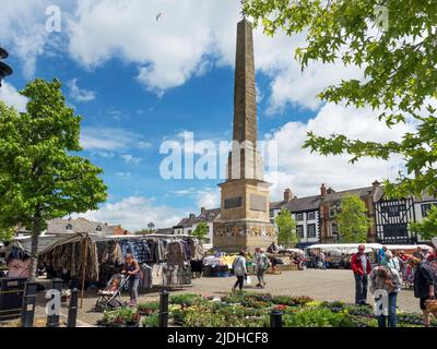 Busy Market Place around the obelisk on market day at Ripon North Yorkshire England Stock Photo