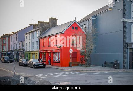BANDON, COUNTY CORK, IRELAND. MARCH 29, 2022. Apache Pizza facade. Street view to small town. Sunset. Stock Photo