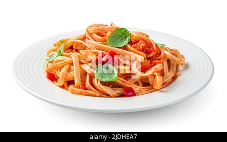 Pasta with tomatoes and basil is isolated on a white background. Stock Photo