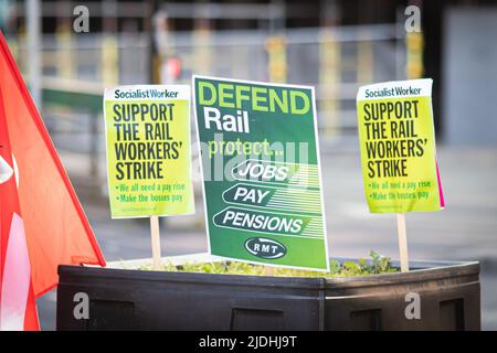 Manchester, UK. 21st June, 2022. RMT placards seen at Piccadilly train station. The biggest rail strike in over 30 years went ahead after last-minute talks failed. RMT states it has no choice but to strike due to proposed cuts to jobs, pay and pensions. Credit: SOPA Images Limited/Alamy Live News Stock Photo