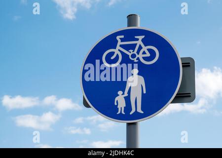 A roadsign indicating an unsegregated mixed use lane that is for use of both pedestrians and cyclists. Stock Photo