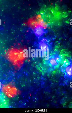 Abstract creative background with blurred bokeh, colorful bright color backdrop, dark blue futuristic wallpaper, round bokeh in shape of a circle. Nig Stock Photo