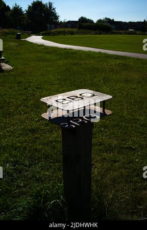 Metal barbecue safety stand for disposable barbecues in public park in Eastleigh near Southampton Hampshire England to prevent fires and accidents. Stock Photo