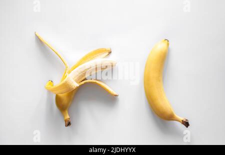 Two bananas on a white background isolated, conceptual minimalism. Stock Photo