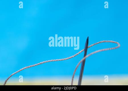 Leather craft tools on a wooden background. Leather craftmans work desk . Piece of hide and working handmade tools on a work table Stock Photo