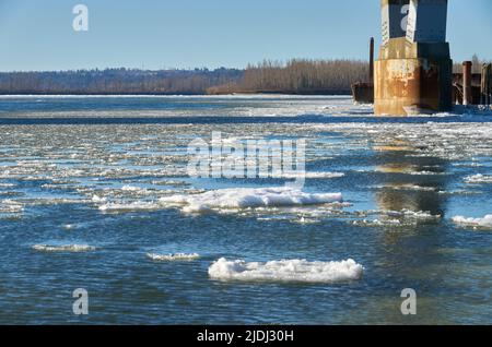 Winter Fraser River Ice Chunks. The Fraser River with floating ice in the winter. Mission, British Columbia, Canada. Stock Photo