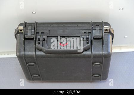 Tough Black Protective Case With Pressure Valve in Van Stock Photo