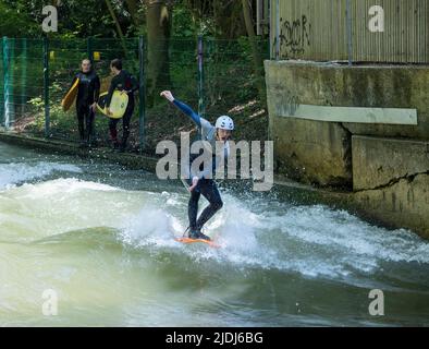 Surfer on the Eisbach river, English Garden city park, Munich, Germany Stock Photo