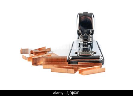 Silhouette of metal stapler with staples on isolated white background. Stock Photo