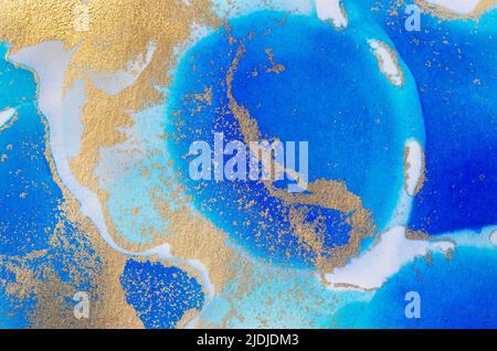 Alcohol-based ink texture in blue tones with gold. Copy space. Stock Photo