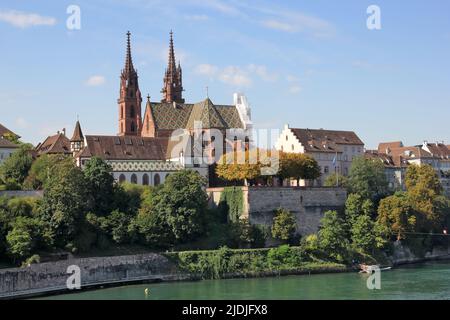 Swiss city Basel over the Rhine river with Muenster church Stock Photo