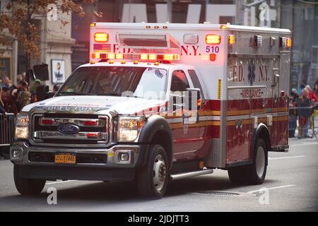 Manhattan, New York,USA - November 11. 2019: FDNY Ambulance on Fifth Avenue at the Veterans Day Parade in NYC. Ambulance flashing lights and siren Stock Photo
