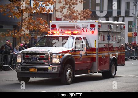 Manhattan, New York,USA - November 11. 2019: FDNY Ambulance on Fifth Avenue at the Veterans Day Parade in NYC. Ambulance flashing lights and siren Stock Photo
