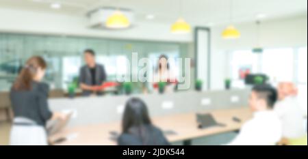 Blurred background of people meeting in office or co working space. Stock Photo