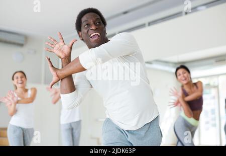 Group of multinational people practicing dance techniques Stock Photo