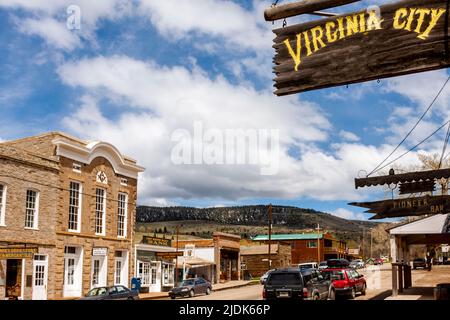 Ghost town at Virginia City is now a tourist attraction in Montana. Deserted log cabins, train wreck yard and gift shops in town. Stock Photo