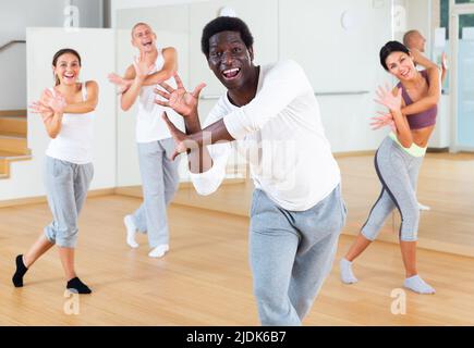 Group of multinational people practicing dance techniques Stock Photo