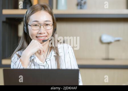 business working woman work at call center customer support team staff on call with headset happy smile portrait Stock Photo