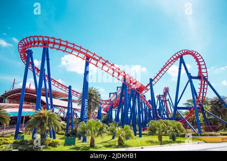 Roller coaster exciting fun amusement railroad track ride in Theme park. Stock Photo
