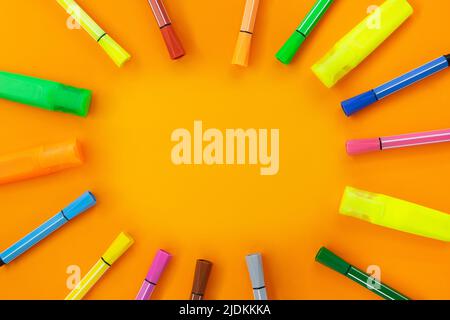 Felt tip pens and markers lie around. Frame from office supplies. Concept Back to school , drawing. Copy space Stock Photo