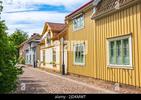 Cobblestone street with beautiful old wooden houses Stock Photo
