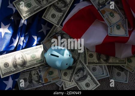 piggy bank with paper currency on an American Flag