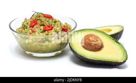 Healthy vegetarian organic guacamole Mexican dip sauce served in glass bowl isolated on white background Stock Photo