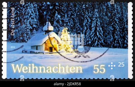 GERMANY - CIRCA 2012: a stamp printed in Germany shows chapel in the snow, Christmas, circa 2012 Stock Photo