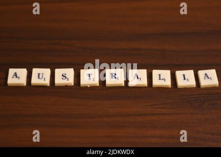 . Made by using the letters in blocks in a wooden background. Selective focused close up shot of Australia word Stock Photo