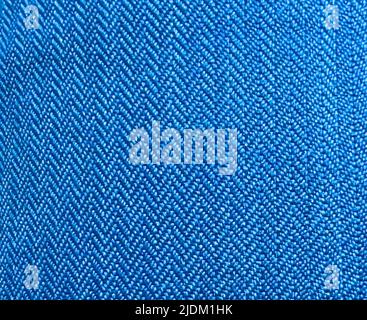 Pattern of blue fabric close-up with triangular shaped stitching Stock Photo