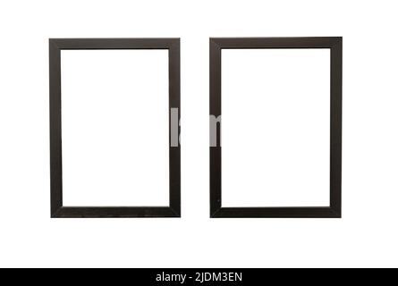 Two natural photo frames with blank space hanging on a wall, isolated on white Stock Photo