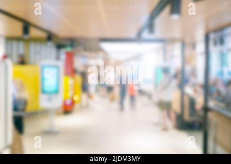 People at a cafe, shopping mall blurred defocused background Stock Photo