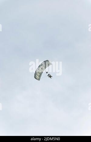 Paratrooper from below. Photo taken during the parachute jumping show during the Commando Fest in Dziwnów - August 2020. Stock Photo