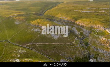 A drone shot of the limestone outcrop Comb Hill and surrounding area around of Malham and Malham Tarn Stock Photo