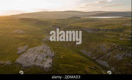 A drone shot of the limestone outcrop Comb Hill and surrounding area around of Malham and Malham Tarn Stock Photo