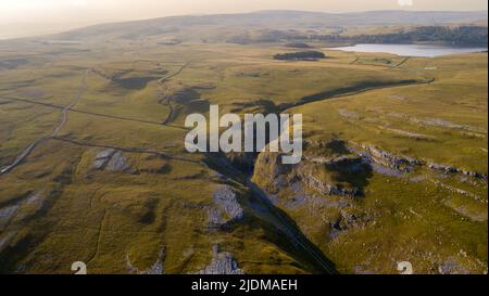 A drone shot of the limestone outcrop Comb Hill and surrounding area around of Malham and Malham Tarn Stock Photo