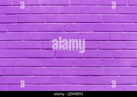 Purple paint brick wall of interior facade lilac texture abstract violet color background. Stock Photo