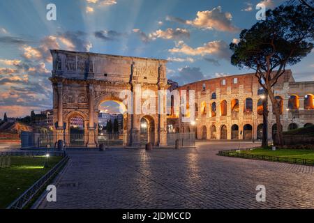 Rome, Italy at the Arch of Constantine and the ancient Roman Colosseum at twilight. Stock Photo