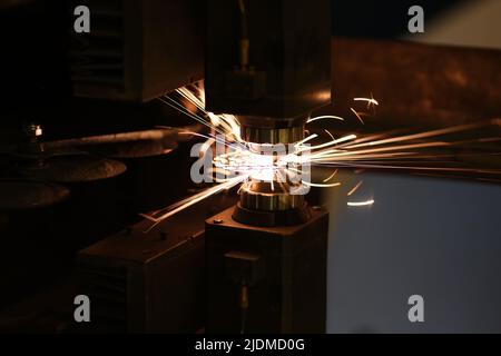 Metal cutting process and neon sparks flying out Stock Photo