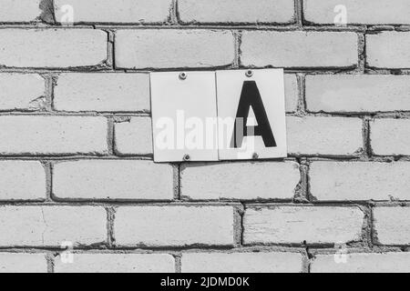 Letter a character A sign white blank object for text and design template house number fragment empty abstract home brick wall symbol. Stock Photo