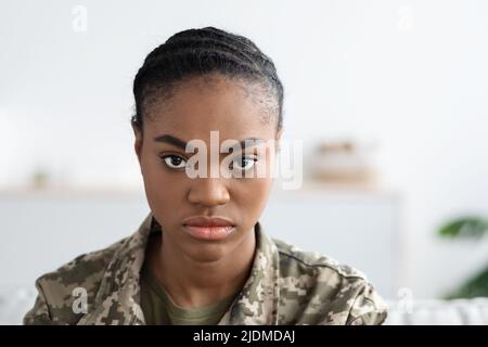 Closeup Shot Of Young Black Soldier Lady With Serious Face Expression Stock Photo