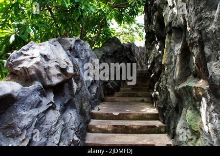 Exterior design of classic stone cement stairs in forest garden park for thai people walking steps up to second floors of Thailand Stock Photo