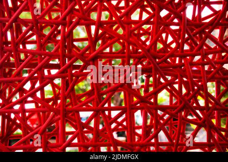 Artistic interior decoration with handmade red color rattan and bamboo wicker weave of classic art and crafts furniture background Stock Photo