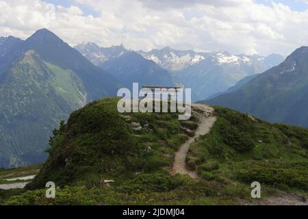 Zillertal, Austria, Penken mountain, a wooden bench invites to linger, selective focus Stock Photo