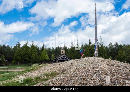 Pilgrims on the Cruz de Ferro, Spain. Camino de Santiago Stock Photo ...