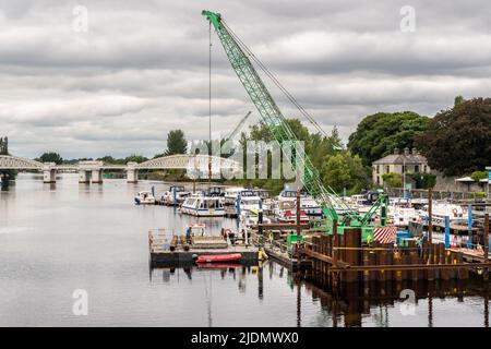 Athlone, Co. Westmeath, Ireland. 22nd June, 2022. Construction of the Dublin to Galway greenway pedestrian and cycle bridge across the River Shannon continues at pace. The bridge is expected to be completed at the end of 2023. Credit: AG News/Alamy Live News Stock Photo