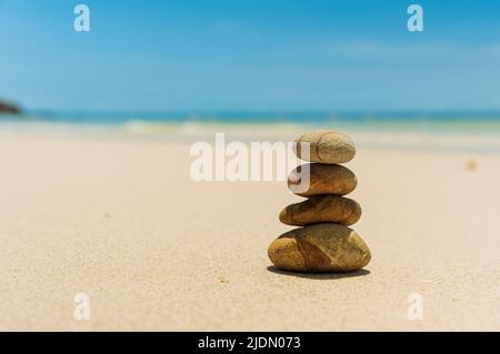 Stones balanced on beach. Zen stones meditation and relaxation. Japanese zen garden Stock Photo
