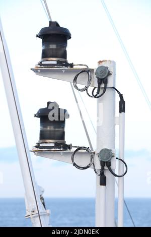 Navigation and radar equipment and antenna on the mast of cruise ship Stock Photo